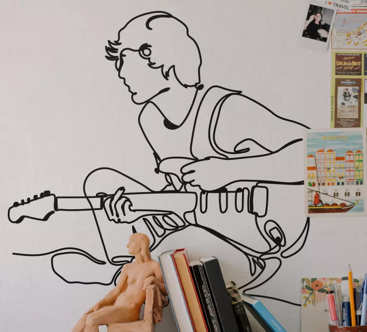 Poika kitaraa soittamassa Rockmusiikkitarra - Tenstickers